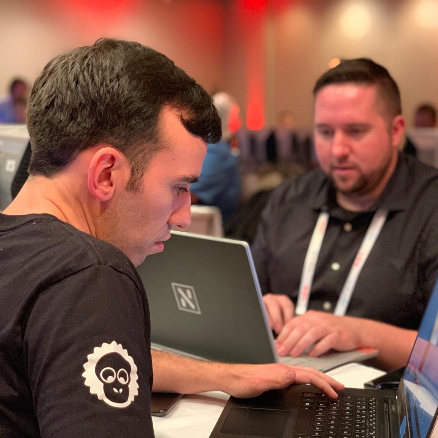 Developers at the hackathon wearing merch